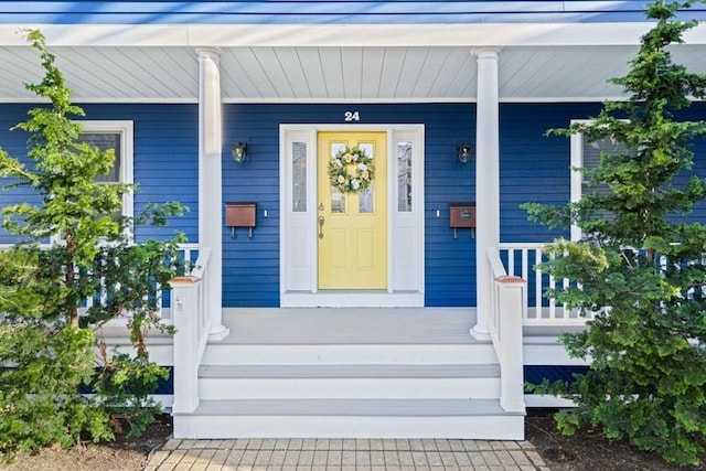 entrance to property featuring covered porch