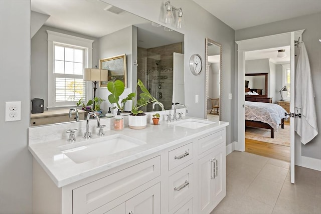 27 Gully Ln, Sandwich, MA 02537 - full bathroom with ensuite bath, a stall shower, double vanity, and tile patterned flooring
