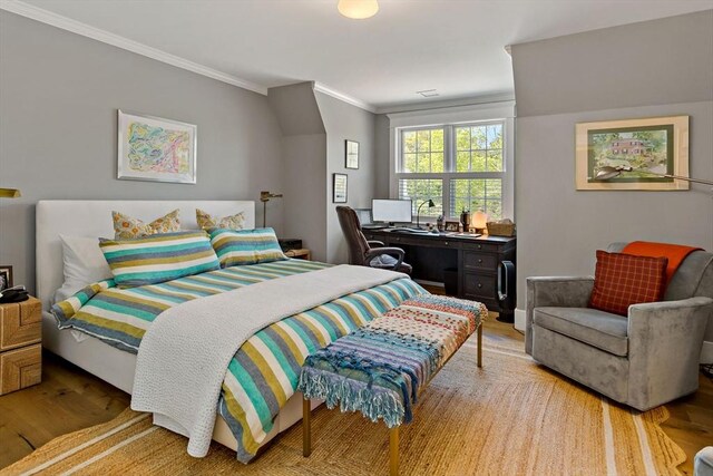 27 Gully Ln, Sandwich, MA 02537 - bedroom with crown molding, light wood-style flooring, and an office area