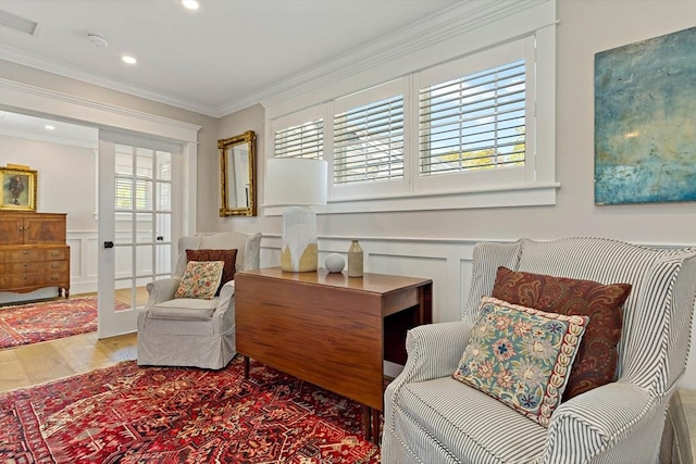 27 Gully Ln, Sandwich, MA 02537 - sitting room featuring a decorative wall, wood finished floors, crown molding, wainscoting, and recessed lighting