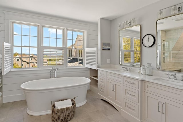 27 Gully Ln, Sandwich, MA 02537 - bathroom with double vanity, a freestanding tub, and a shower