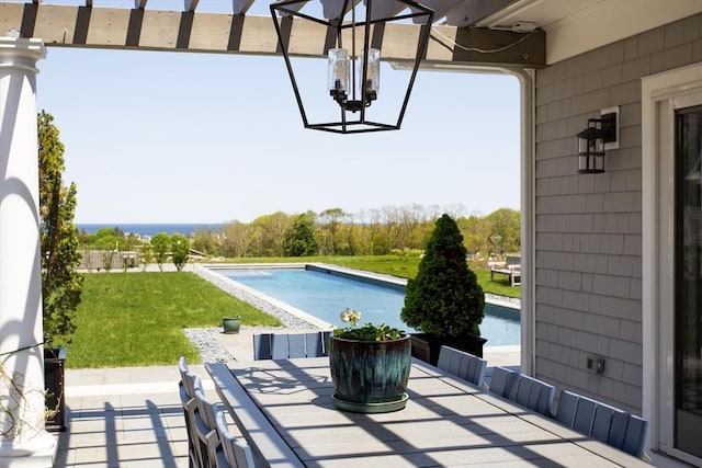 27 Gully Ln, Sandwich, MA 02537 - view of patio with an outdoor pool, outdoor dining space, and a water view