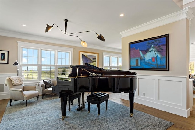 27 Gully Ln, Sandwich, MA 02537 - sitting room featuring crown molding, healthy amount of natural light, a decorative wall, wainscoting, and wood finished floors