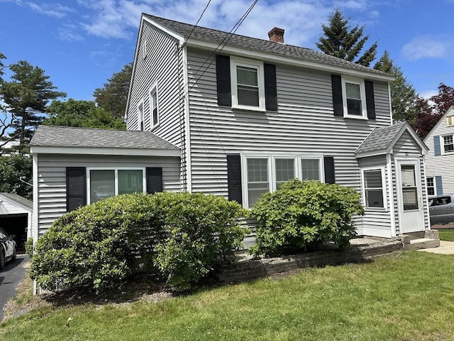 10 Marilyn Dr, Auburn, MA 01501 - view of front of home featuring a chimney and a front lawn