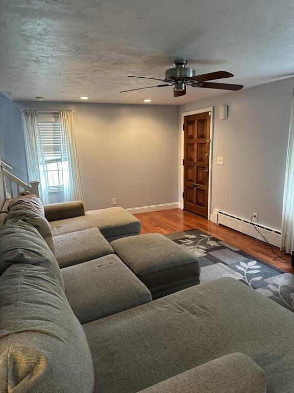 10 Marilyn Dr, Auburn, MA 01501 - living area with a baseboard radiator, ceiling fan, wood finished floors, and recessed lighting