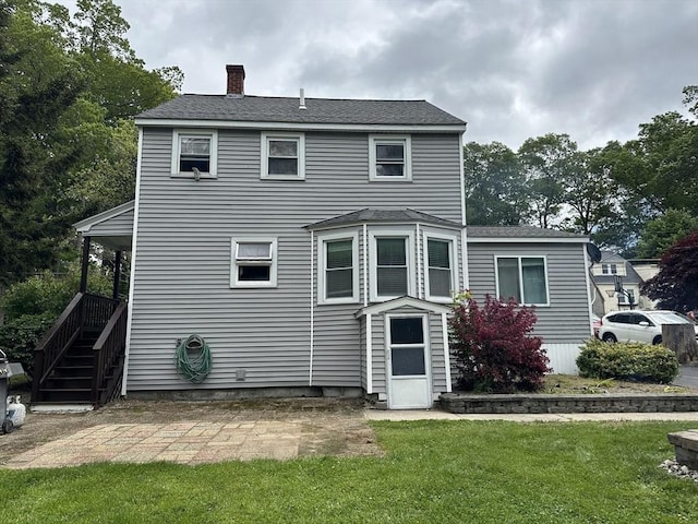 10 Marilyn Dr, Auburn, MA 01501 - rear view of property with a chimney, a yard, a patio, and roof with shingles