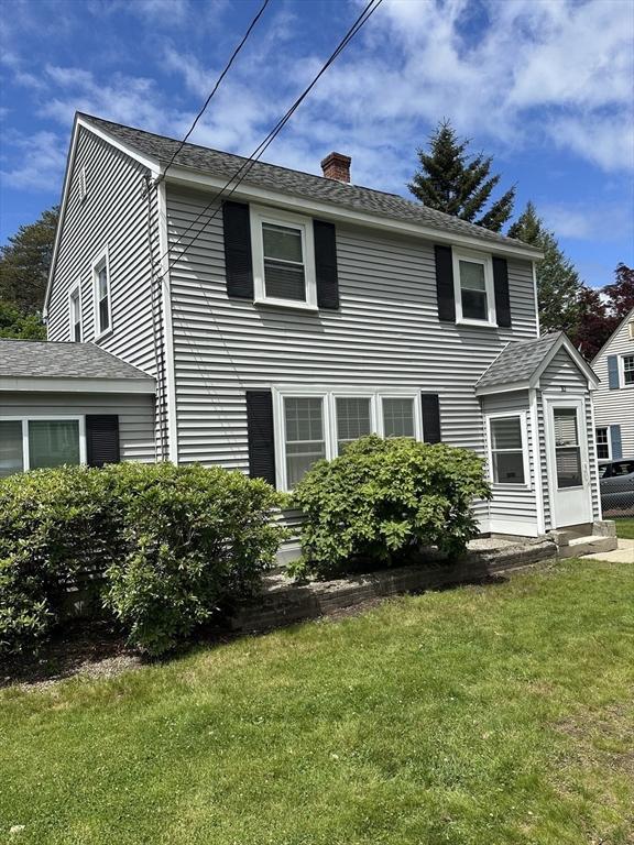 10 Marilyn Dr, Auburn, MA 01501 - view of front of property with a chimney and a front yard