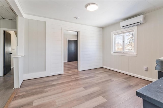 interior space featuring an AC wall unit and hardwood / wood-style floors