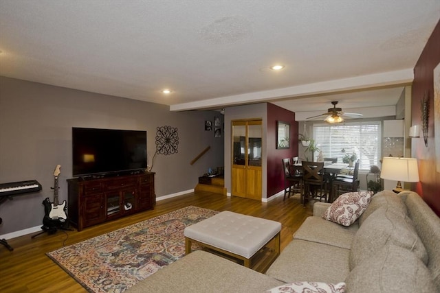 living room with recessed lighting, baseboards, and wood finished floors