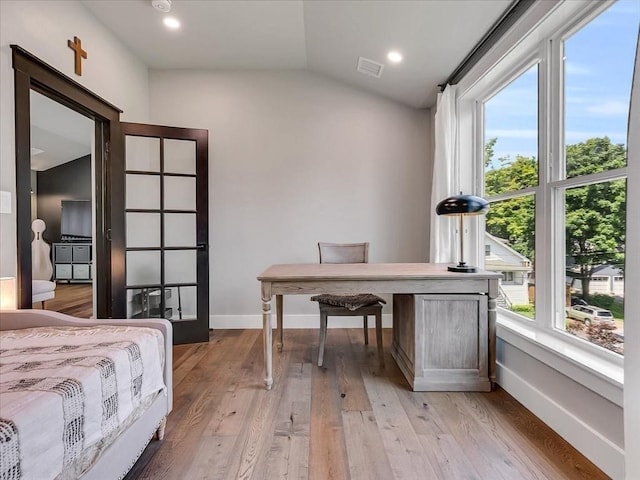 bedroom featuring lofted ceiling, recessed lighting, visible vents, light wood-type flooring, and baseboards