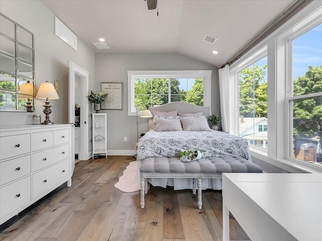 bedroom featuring recessed lighting, visible vents, baseboards, vaulted ceiling, and light wood-type flooring