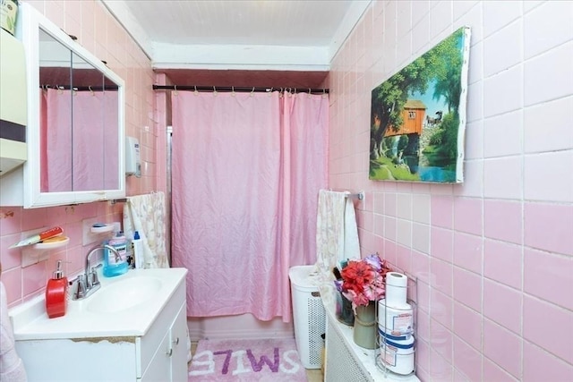 bathroom with vanity, tile walls, and decorative backsplash