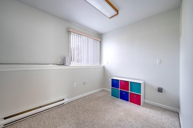 interior space featuring carpet floors, baseboards, and baseboard heating