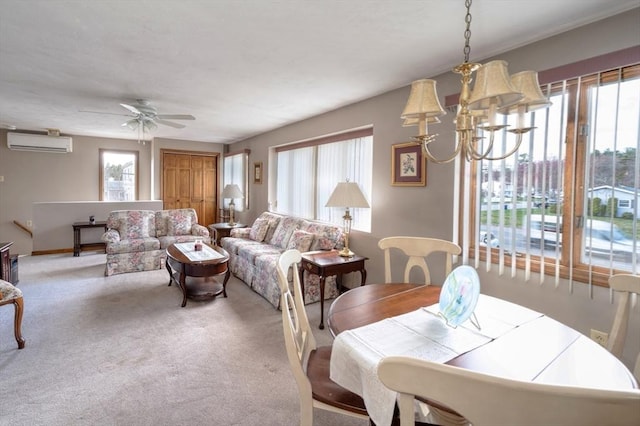 carpeted dining room featuring ceiling fan with notable chandelier and a wall mounted air conditioner