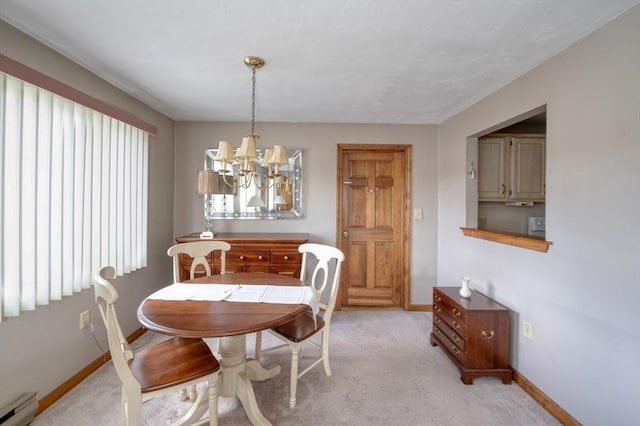 dining room featuring an inviting chandelier, baseboards, a baseboard radiator, and light colored carpet