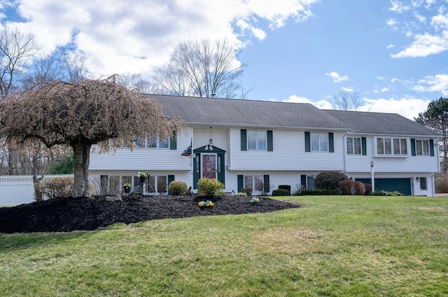 split foyer home featuring a front lawn