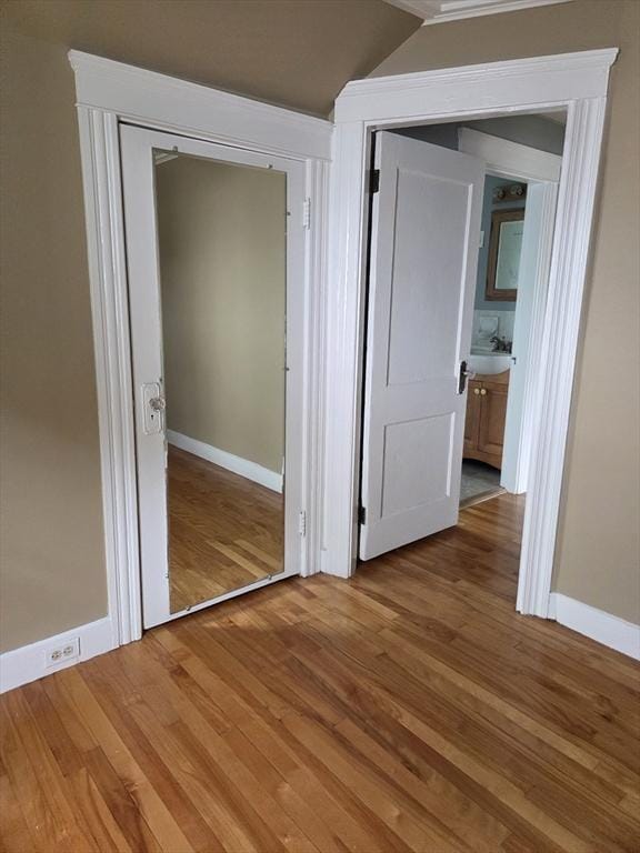 26 Kendig, Worcester, MA 01610 - unfurnished bedroom with wood finished floors, lofted ceiling, and a closet