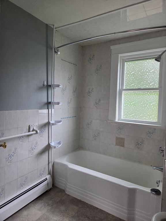 26 Kendig, Worcester, MA 01610 - bathroom featuring baseboard heating, tile walls, and tile patterned flooring