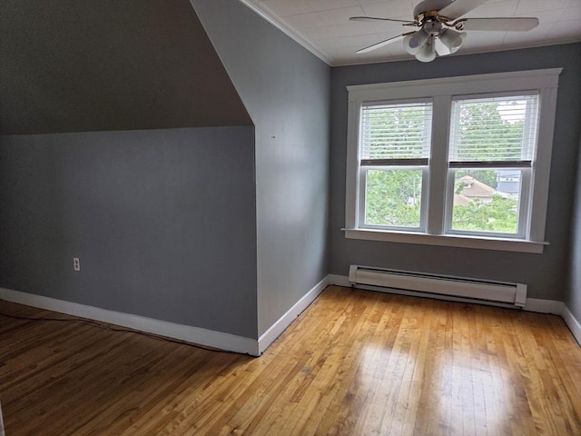 26 Kendig, Worcester, MA 01610 - additional living space with a baseboard radiator, ceiling fan, and light wood-style flooring
