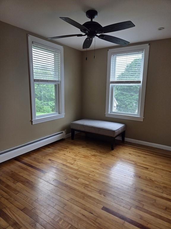 26 Kendig, Worcester, MA 01610 - unfurnished room featuring light wood-style flooring, a ceiling fan, and baseboard heating
