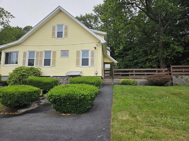26 Kendig, Worcester, MA 01610 - view of front of property with a front lawn and a wooden deck