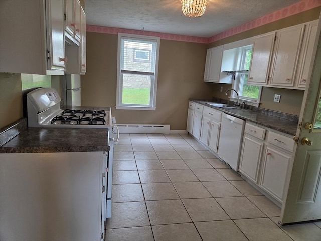 26 Kendig, Worcester, MA 01610 - kitchen with white appliances, dark countertops, baseboard heating, and white cabinets
