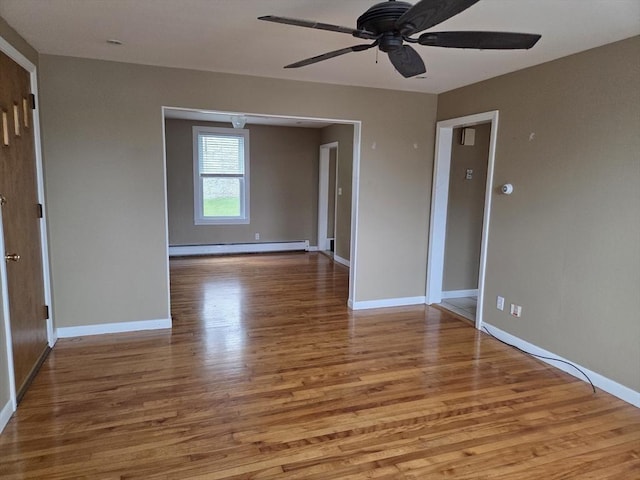 26 Kendig, Worcester, MA 01610 - empty room with a baseboard radiator, wood finished floors, and a ceiling fan