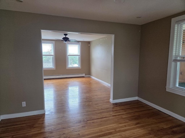 26 Kendig, Worcester, MA 01610 - empty room with a baseboard radiator, wood finished floors, and ceiling fan