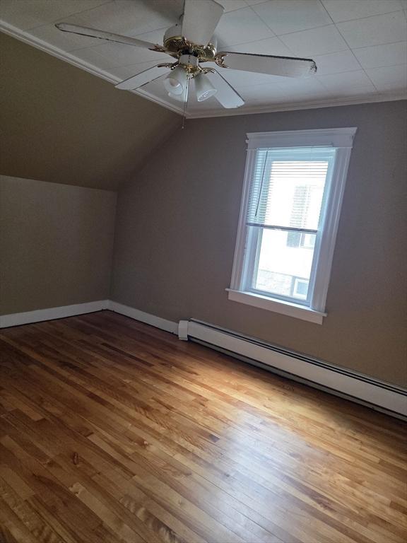 26 Kendig, Worcester, MA 01610 - bonus room with a baseboard radiator, wood finished floors, lofted ceiling, and a ceiling fan