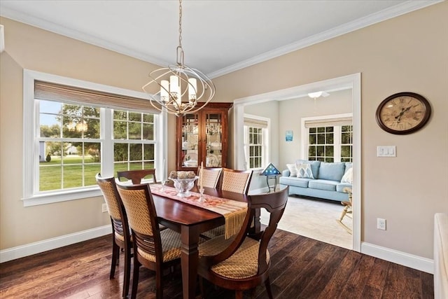 dining room with an inviting chandelier, ornamental molding, and wood-type flooring