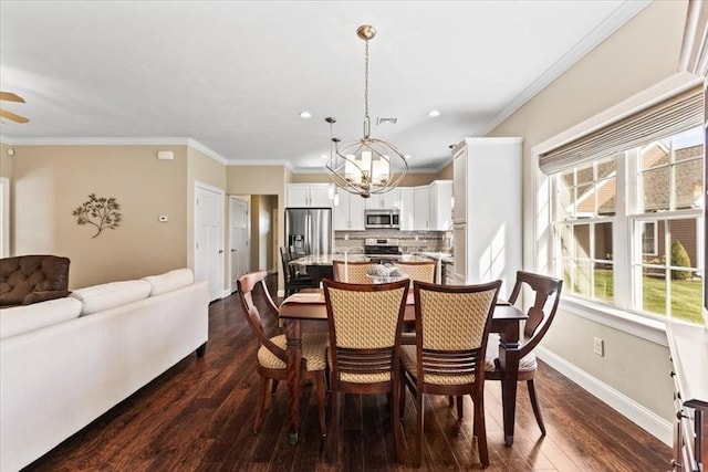 dining room with dark hardwood / wood-style flooring, crown molding, and ceiling fan with notable chandelier