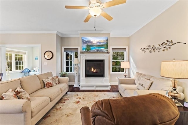 living room with ceiling fan, ornamental molding, and hardwood / wood-style floors