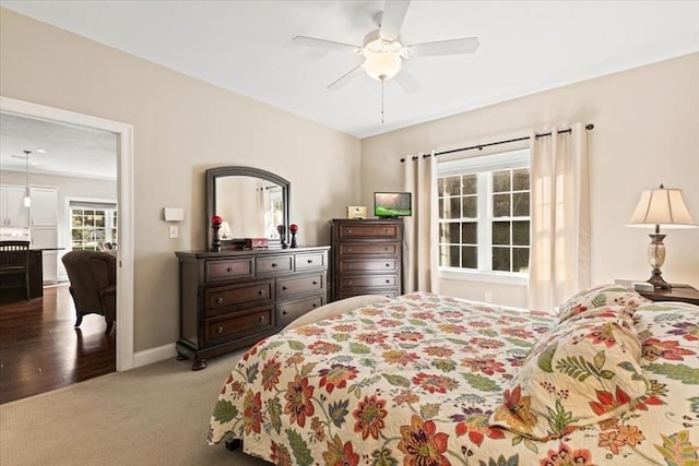 bedroom featuring light colored carpet and ceiling fan