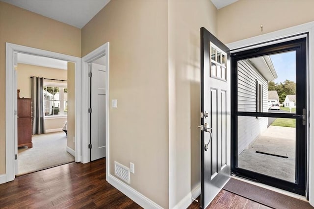 foyer entrance with dark wood-type flooring