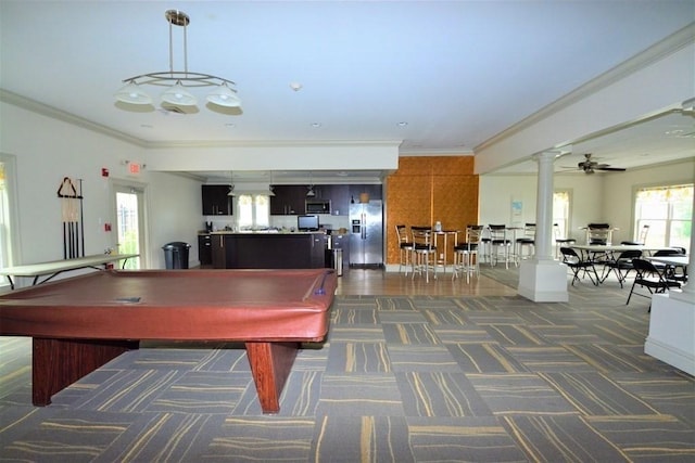 recreation room with ornate columns, dark colored carpet, ornamental molding, and pool table