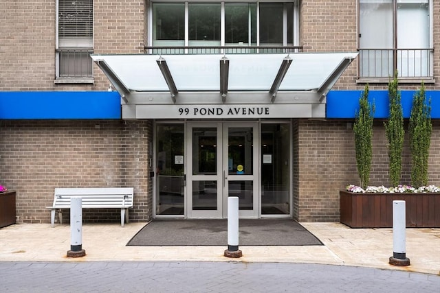 99 Pond Ave Unit 220, Brookline, MA 02445 - entrance to property featuring brick siding