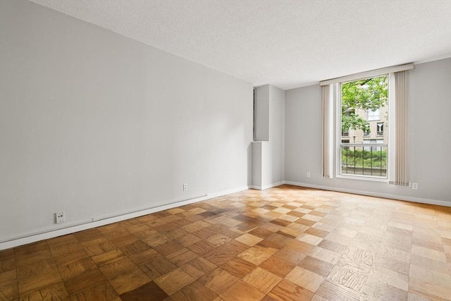 99 Pond Ave Unit 220, Brookline, MA 02445 - spare room with a textured ceiling