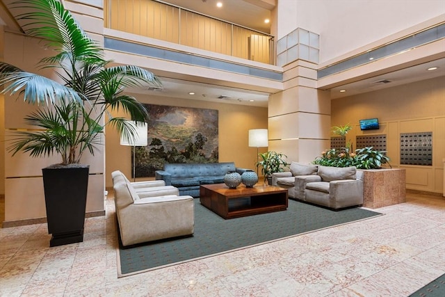 99 Pond Ave Unit 220, Brookline, MA 02445 - building lobby featuring a high ceiling and recessed lighting