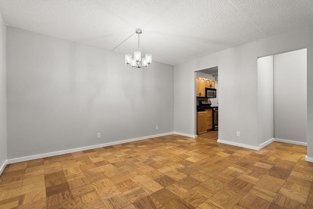 99 Pond Ave Unit 220, Brookline, MA 02445 - unfurnished room with a chandelier and a textured ceiling