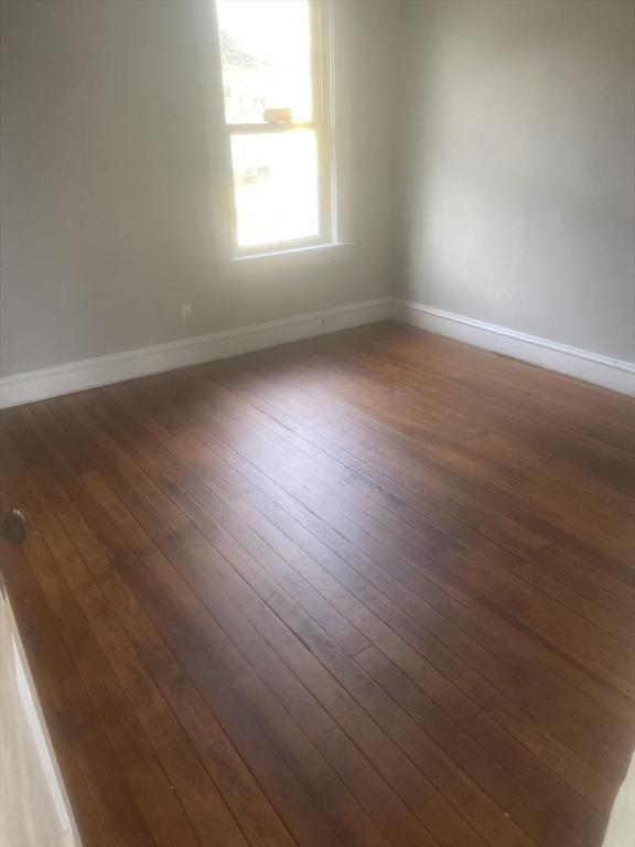583 Center St, Fall River, MA 02720 - unfurnished room featuring dark wood-type flooring and baseboards