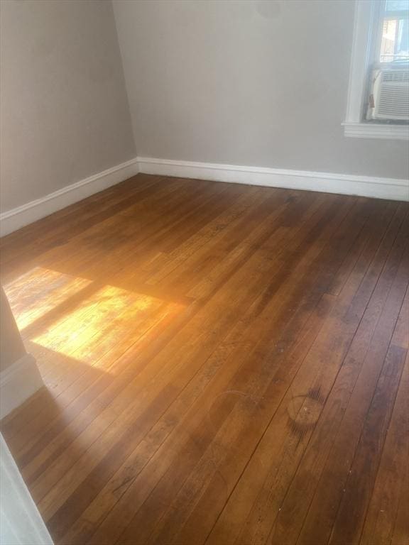 583 Center St, Fall River, MA 02720 - empty room featuring dark wood-type flooring and baseboards
