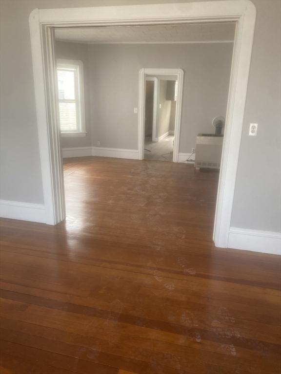 583 Center St, Fall River, MA 02720 - hallway with wood finished floors and baseboards