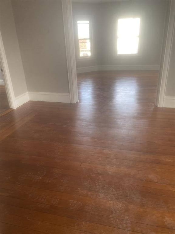 583 Center St, Fall River, MA 02720 - empty room with dark wood-style floors and baseboards