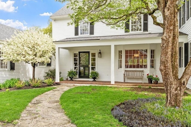 894 Great Pond Rd, North Andover, MA 01845 - view of front of home featuring a front yard, a porch, and roof with shingles