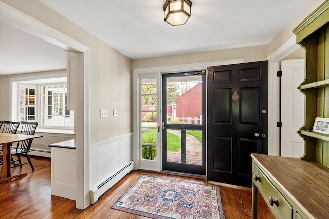 894 Great Pond Rd, North Andover, MA 01845 - entrance foyer with a baseboard heating unit and wood finished floors
