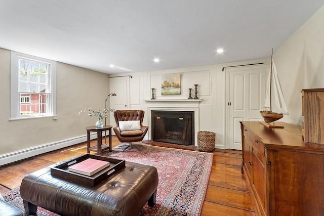 894 Great Pond Rd, North Andover, MA 01845 - living room featuring hardwood / wood-style floors, a glass covered fireplace, and recessed lighting