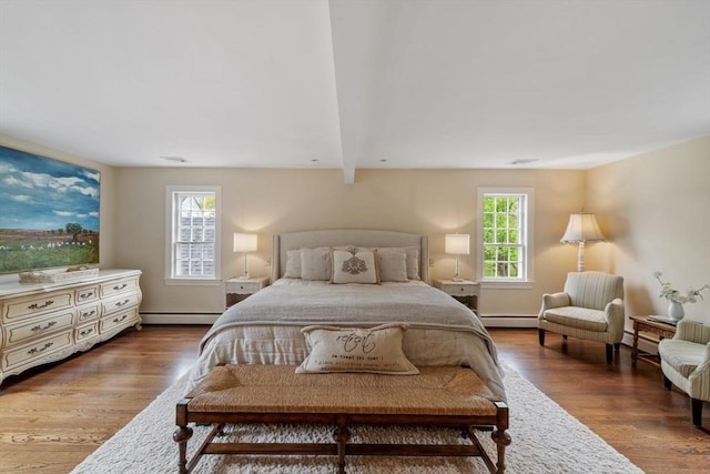894 Great Pond Rd, North Andover, MA 01845 - bedroom featuring a baseboard heating unit, baseboard heating, and wood finished floors