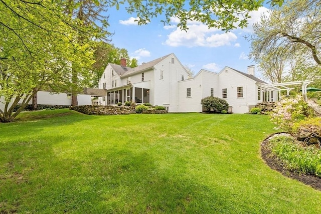 894 Great Pond Rd, North Andover, MA 01845 - back of house featuring a yard and a chimney