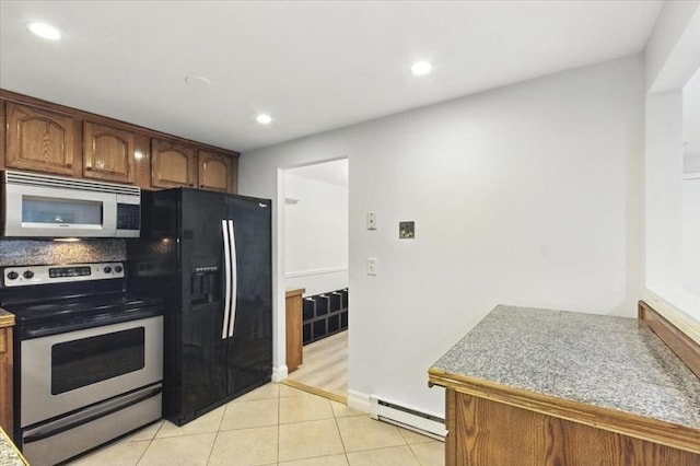 386 Great Rd Unit A3, Acton, MA 01720 - kitchen with appliances with stainless steel finishes, a baseboard heating unit, light tile patterned floors, and recessed lighting