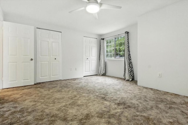 386 Great Rd Unit A3, Acton, MA 01720 - unfurnished bedroom featuring two closets, carpet, and ceiling fan